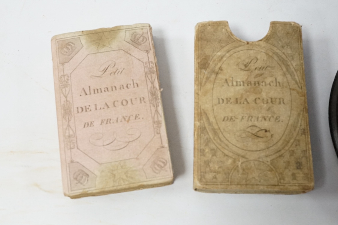 An 1813 Napoleonic Almanack and a reverse glass painted portrait silhouette, 1791, 15cm in diameter. Condition - fair/good